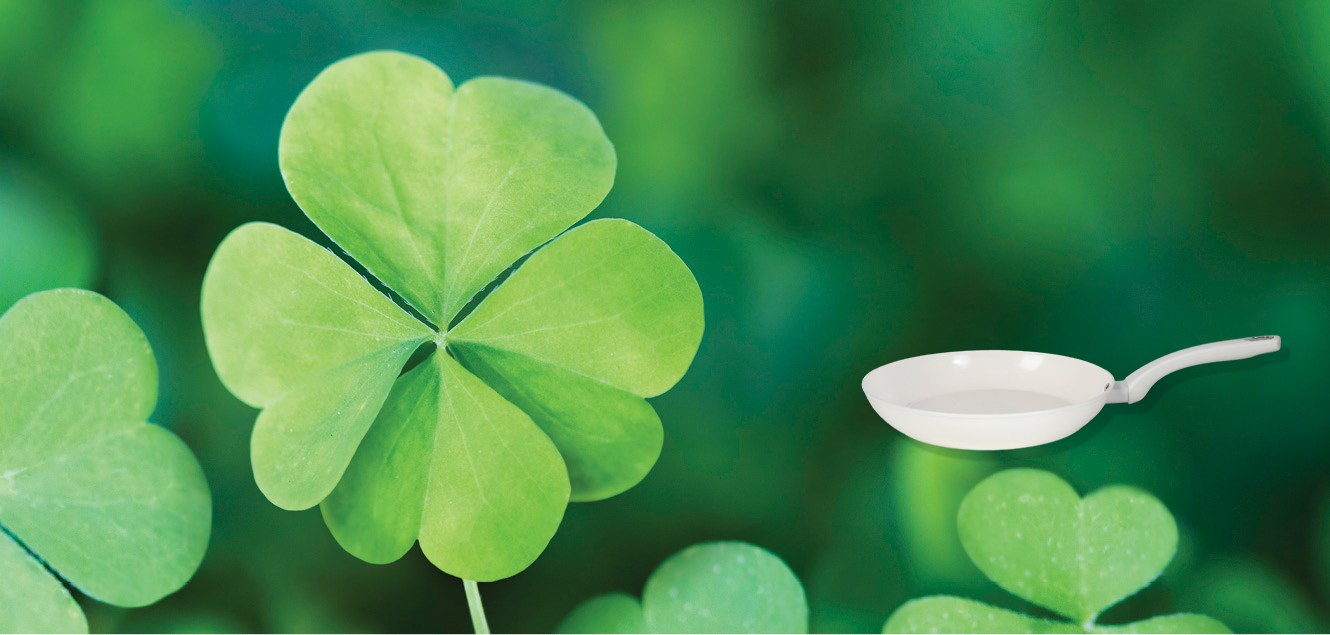 4 leaf clover, green back ground, linen frying pan.